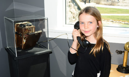 Girl holding old phone