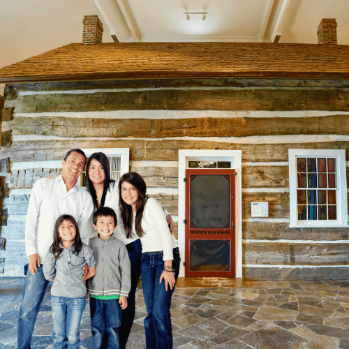 Family in front of 1881 Dufferin House