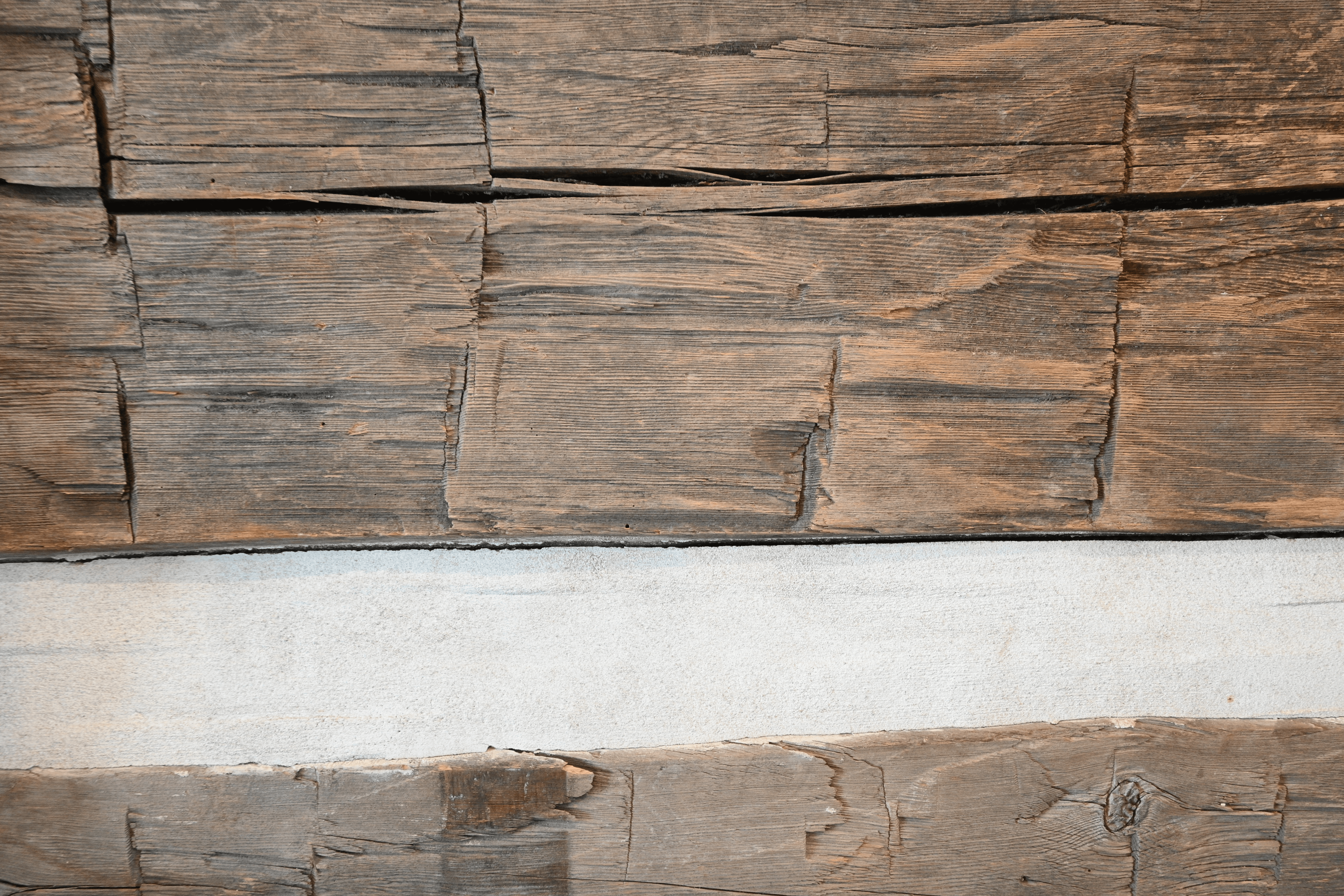 A close up of the timber used to construct the log cabin. Axe marks are visible, which tells us the trees were hand-hewn.